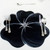 Buttercup Placemat - Black/Silver Carole Shiber Designs, decorative black and silver flower-shaped placemat with cut-out details
