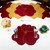 Buttercup Placemat - Copper/Bronze Carole Shiber Designs, floral pattern copper and bronze placemats on a white dining table with tableware and colorful napkin holders.