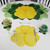 Buttercup Placemat - Yellow Carole Shiber Designs, a bright yellow floral placemat with a large buttercup flower design on a white table. Buttercup Placemat - Yellow Carole Shiber Designs, a bright yellow floral placemat with a large buttercup flower design on a white table.