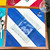 Diagonal Stripes - Blue  Carole Shiber Designs, a glass plate placed on a table with blue, white, and red striped placemats, set with silverware and wine glasses.
