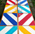 Diagonal Stripes - Blue, a colorful table with diagonal stripe patterns in red, yellow, blue, and turquoise, featuring wine glasses placed on top, designed by Carole Shiber Designs.