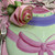Easter Egg Placemat Carole Shiber Designs, colorful Easter-themed fabric with painted egg and pink bow design.