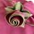 Hot Pink with HoneyDew Trim Napkin Carole Shiber Designs, close-up of a pink napkin with a decorative HoneyDew green and gold trim shaped like a rose.