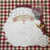 Santa Claus Placemat by Carole Shiber, festive Christmas-themed placemat with Santa's face and beard design.