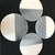 Moonscape Setting Grey & White Carole Shiber Designs, modern circular art with grey and white striated patterns on black background.