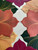 Sweet Fall Mats & Naps, Set/6 Carole Shiber Designs, featuring colorful autumn leaf-shaped mats in shades of red, pink, green, and beige arranged on a white textured surface. Sweet Fall Mats & Naps, Set/6 Carole Shiber Designs, featuring colorful autumn leaf-shaped mats in shades of red, pink, green, and beige arranged on a white textured surface.
