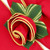 Red with Gold Trim Napkin Carole Shiber Designs, beautifully folded napkin with gold trim and decorative green leaves.