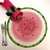 Watermelon Placemat Carole Shiber Designs, decorative watermelon-shaped placemat with pink and green design and black seed accents.