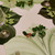 Classic Leaf Combo Starter Set Carole Shiber Designs, an elegant table setting with leaf-shaped placemats, green foliage, and glassware.