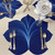 Set of 4 Carole Shiber Designs placemats, Deep Blue/White & White/Silver, featuring a large, elegant floral pattern with a blue and white color scheme.