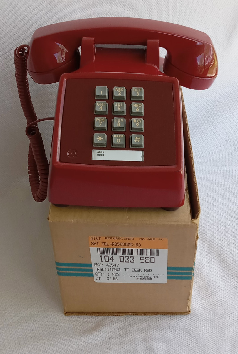 Red 2500 telephone is made by Western Electric and has a volume