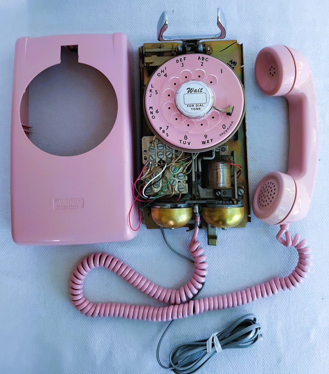 PINK 554 rotary dial wall phone made by Western Electric Company