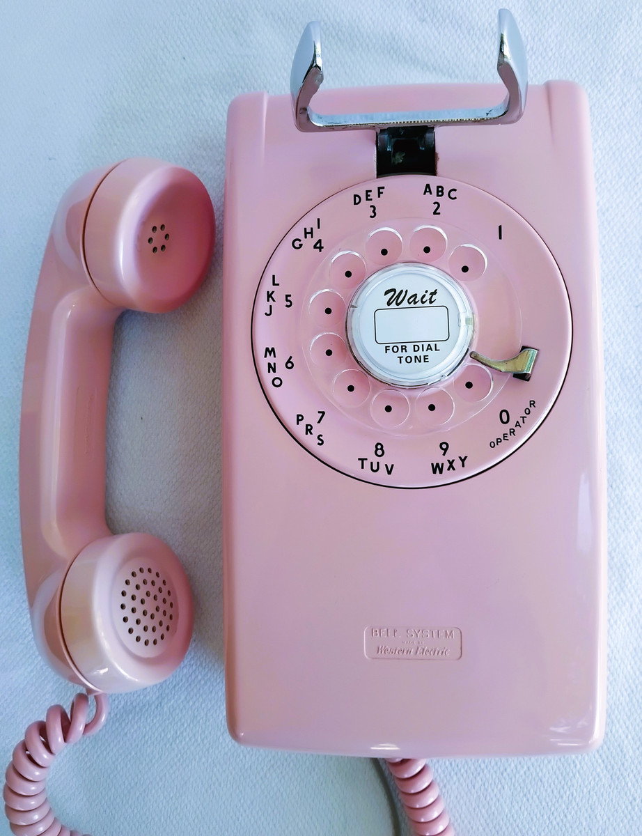 PINK 554 rotary dial wall phone made by Western Electric Company