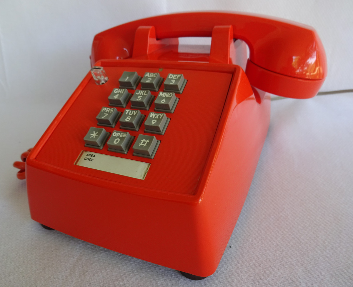 Orange 2500 touch tone telephone made by ITT formerly Stromberg