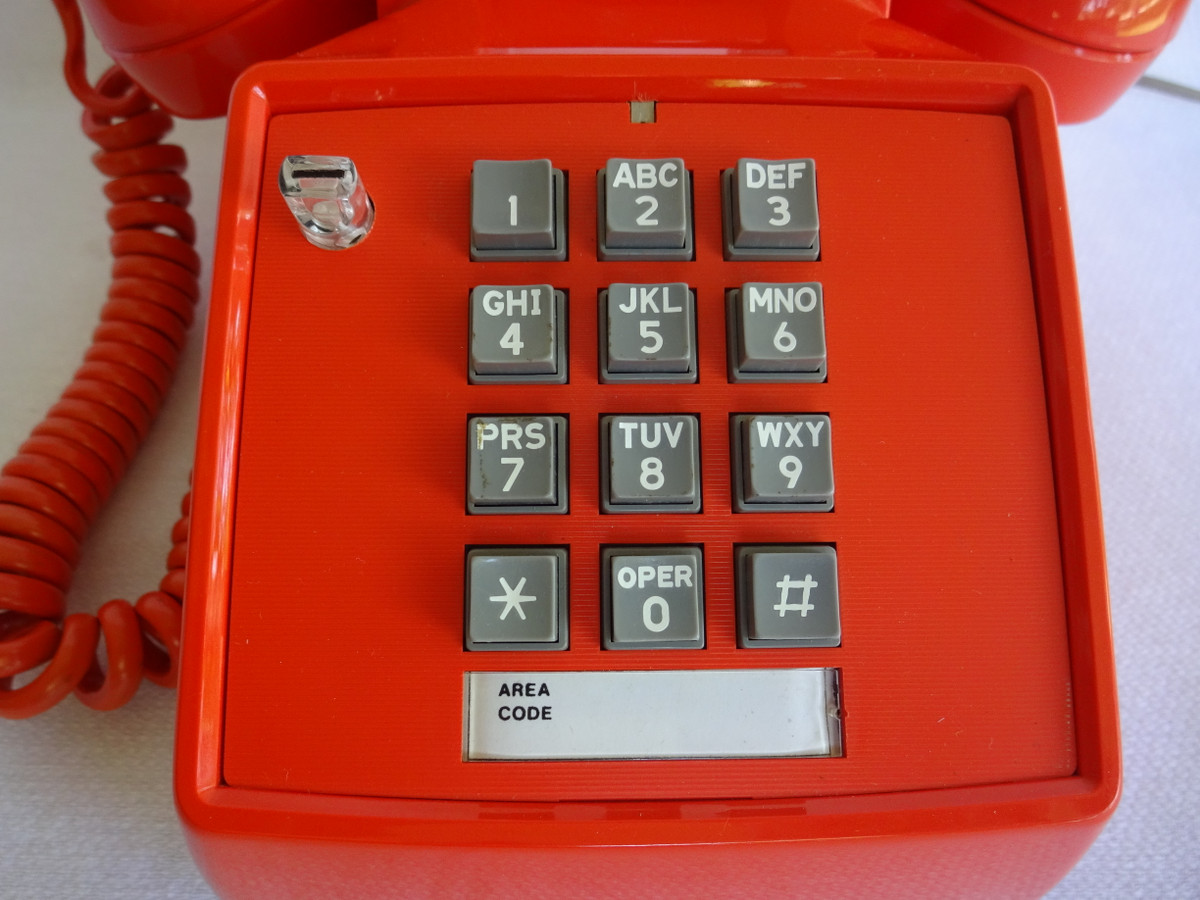 Orange 2500 touch tone telephone made by ITT formerly Stromberg