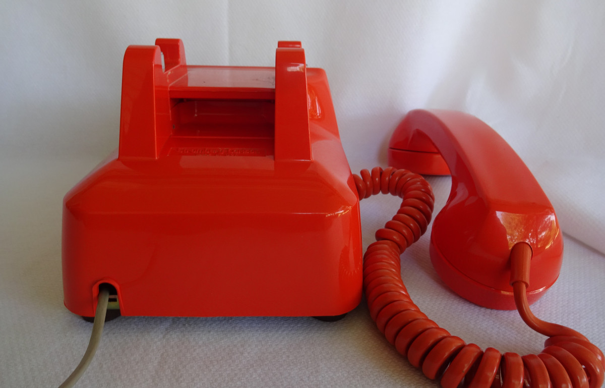 Orange 2500 touch tone telephone made by ITT formerly Stromberg