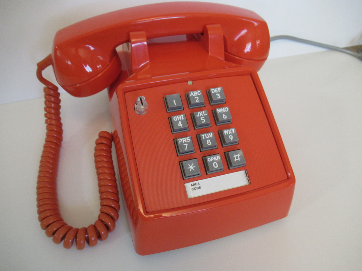 Orange 2500 touch tone telephone made by ITT formerly Stromberg Carlson