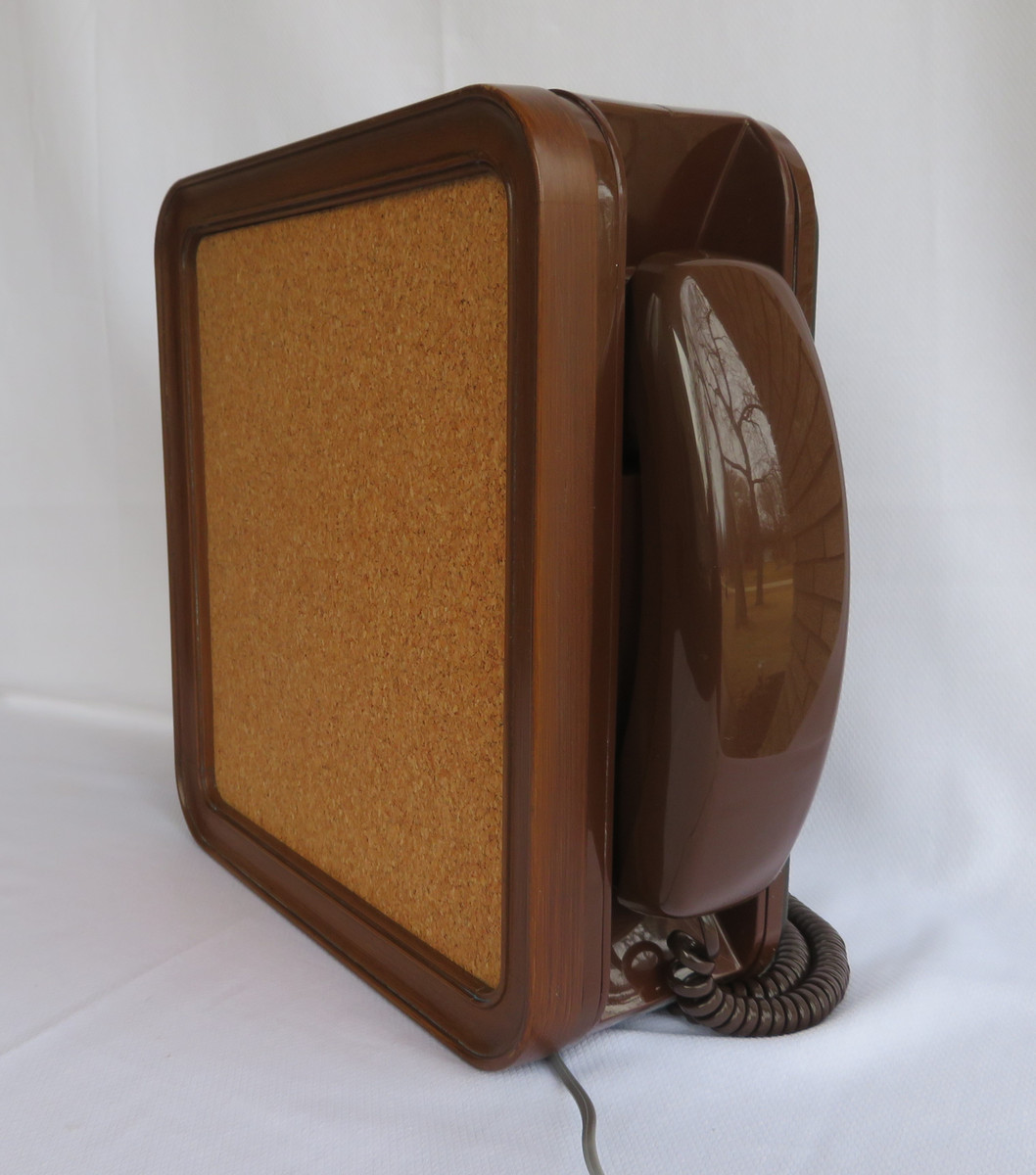 Noteworthy telephoneYellow Western Electric Designline telephone