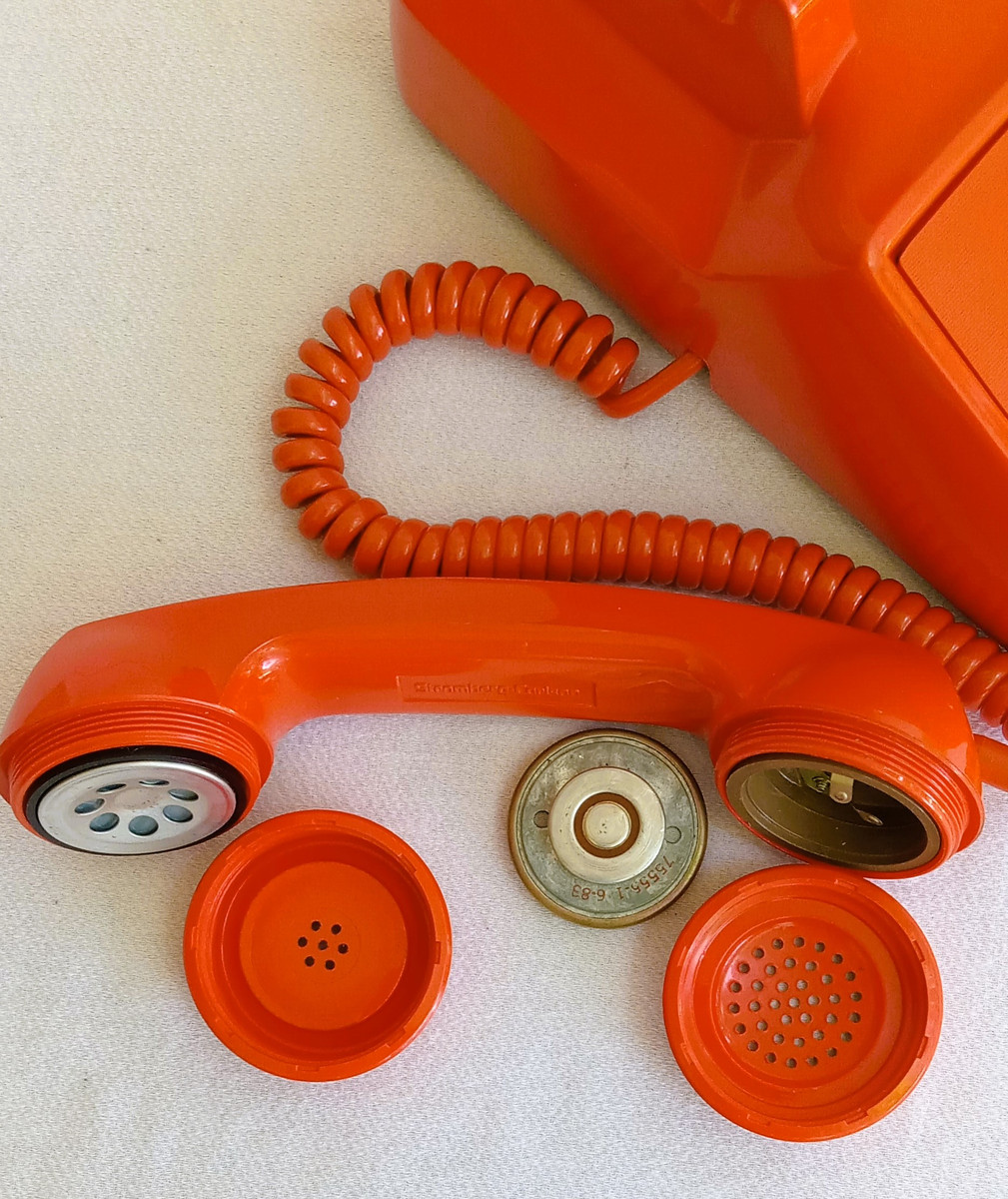 Orange 2500 touch tone telephone made by ITT formerly Stromberg