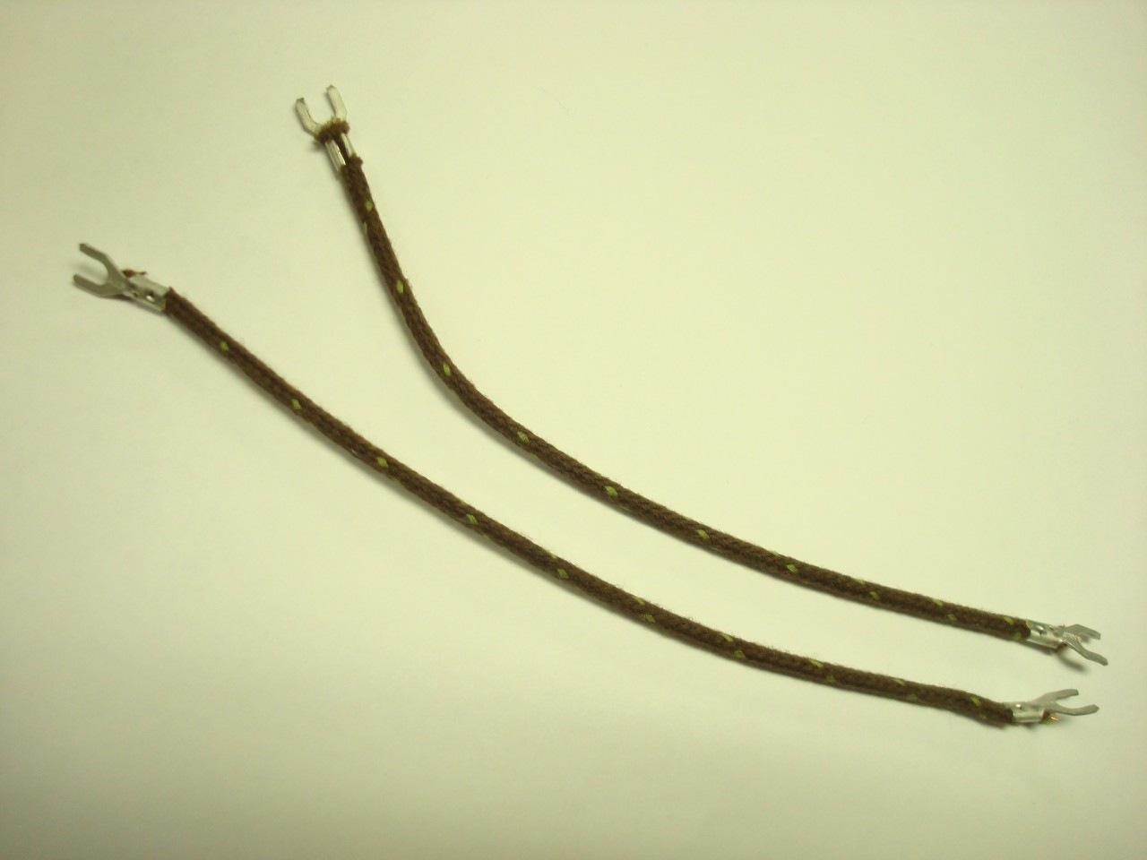 Coth covered tinsel conductor wire used for old telephones is sold per foot at Old Phone Shop