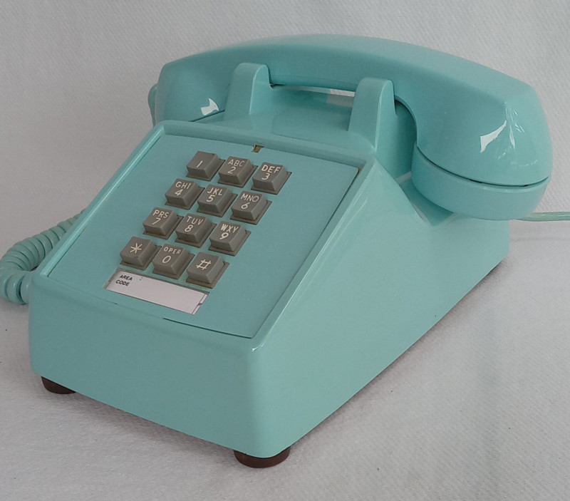Turquoise 2500 desk telephone made by Stromberg Carlson