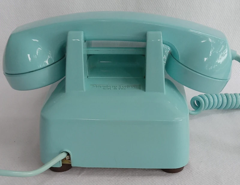 Turquoise 2500 desk telephone made by Stromberg Carlson