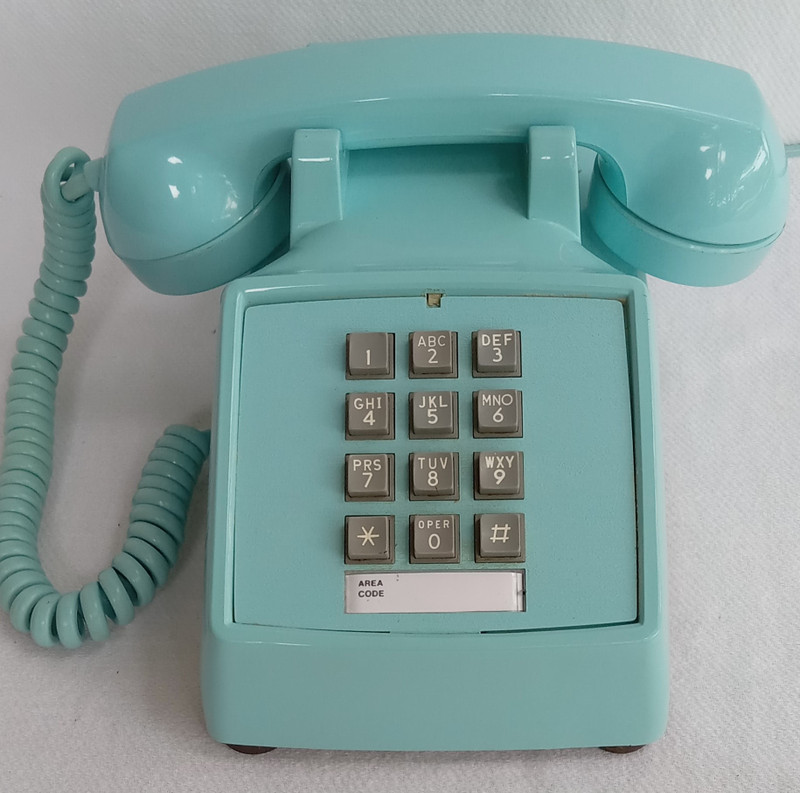 Turquoise 2500 desk telephone made by Stromberg Carlson