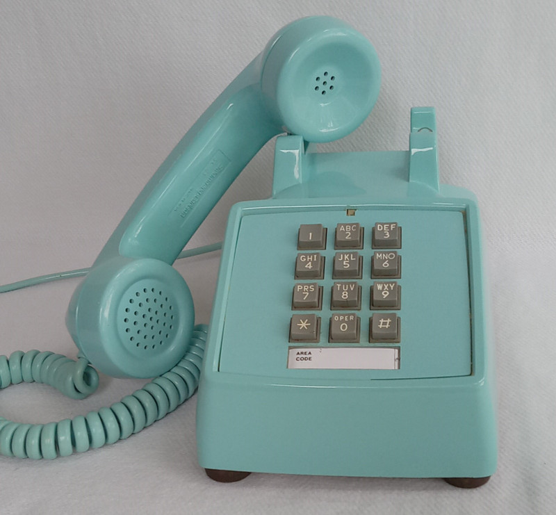 Turquoise 2500 desk telephone made by Stromberg Carlson