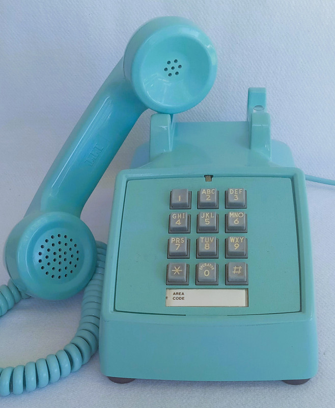 Turquoise 2500 desk telephone made by Stromberg Carlson/ITT