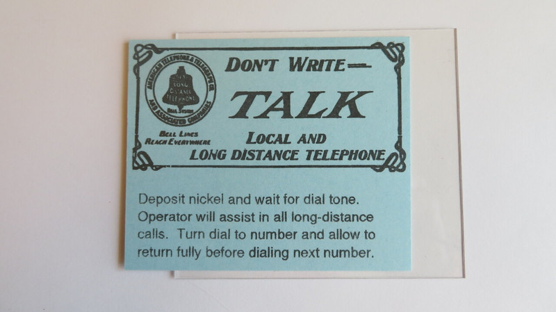 Payphone middle instruction card with plastic cover in blue