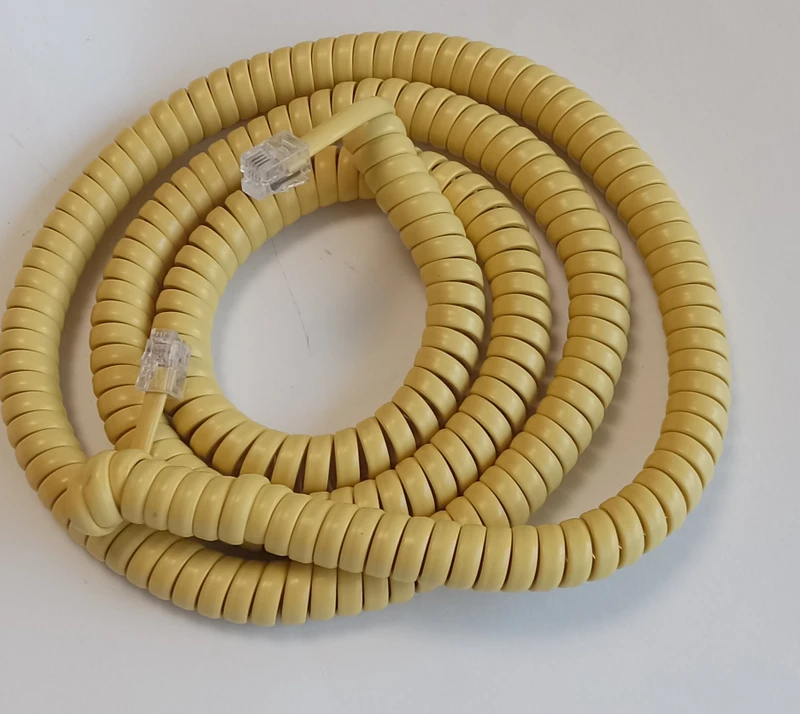 Yellow  coiled handset cord modular 