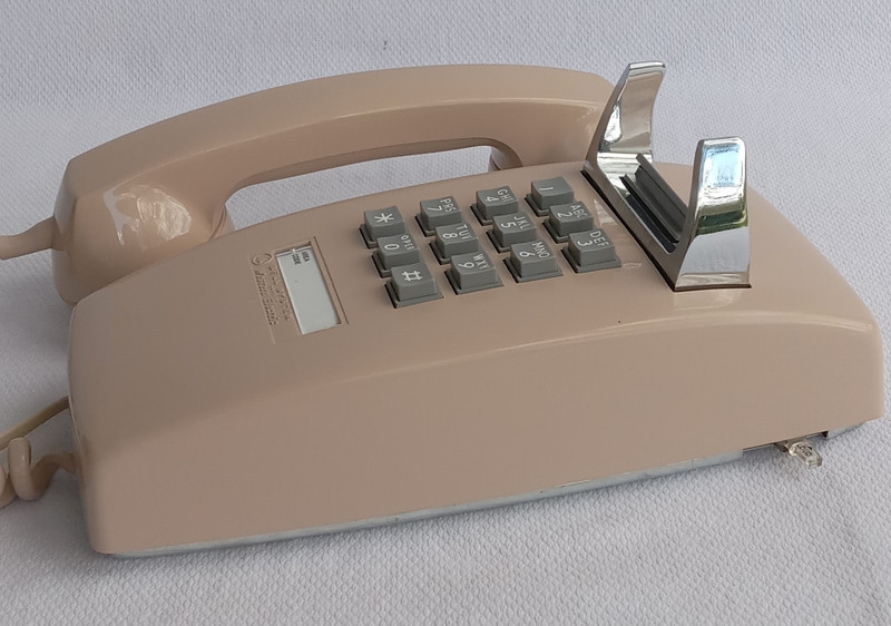 Beige  2554 touch tone wall phone 