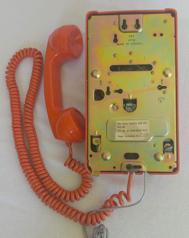 Stromberg Carlson, ITT Rotary dial wall phone Orange 554