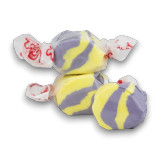 Close-up of Raspberry Lemonade flavoured Taffy Town salt water taffy pieces in yellow and purple swirl colours, available at The Professors