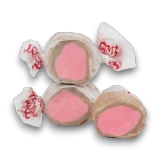 Individually wrapped Taffy Town Chocolate Covered Strawberry taffy pieces showing pink centre, available at The Professors Online Lolly Shop.