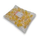 Sweet Treats Yellow Flat Pops 1kg bulk bag showing individually wrapped pineapple flavoured hard candy lollipops.