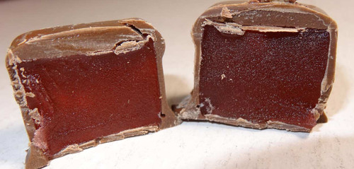 Milk Choc Turkish Delight pieces with rich chocolate coating and rosy centre, available at The Professors Online Lolly Shop.