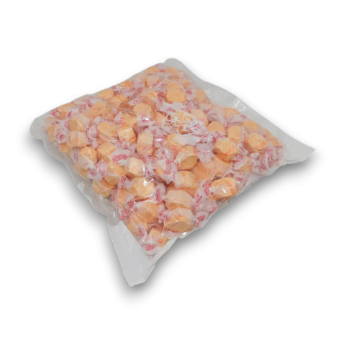 Taffy Town Orange Taffy in soft whipped Salt Water Taffy pieces, packed in a 1.1kg bulk bag for sharing or resale.