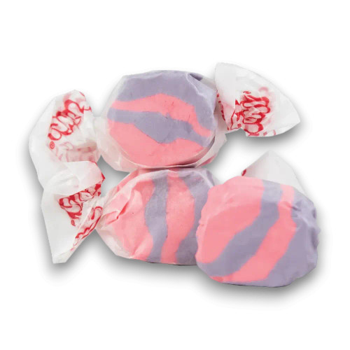 Close-up of Tropical Punch flavoured Taffy Town salt water taffy pieces in pink and purple colours, available at The Professors