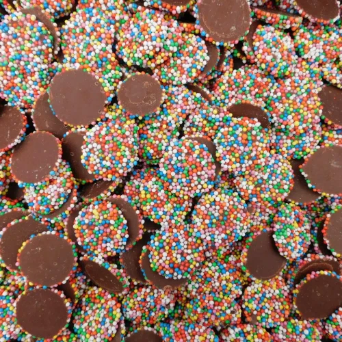 Hugos Chocolates Milk Choc Sparkles topped with multi-coloured sprinkles, supplied in an 8kg bulk box.