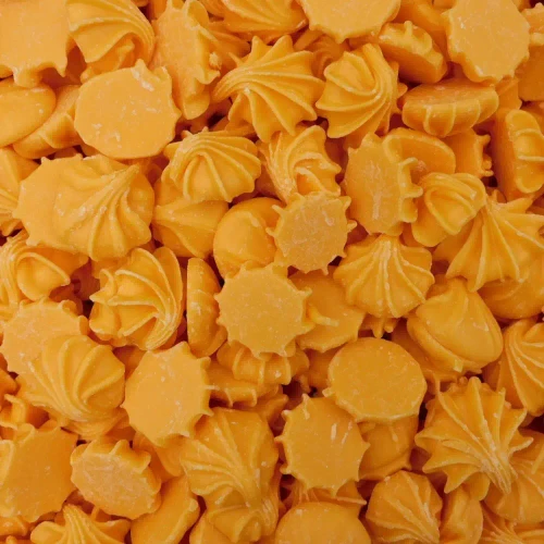Hugos Chocolates Whirls Caramel 8kg showing orange caramel discs with raised swirls at The Professors