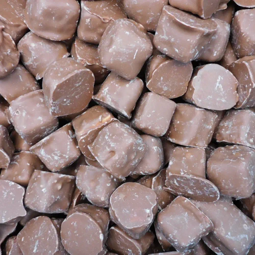 Close-up of The Confectionery House honeycomb pieces coated in milk choc, supplied in a bulk 8kg box.