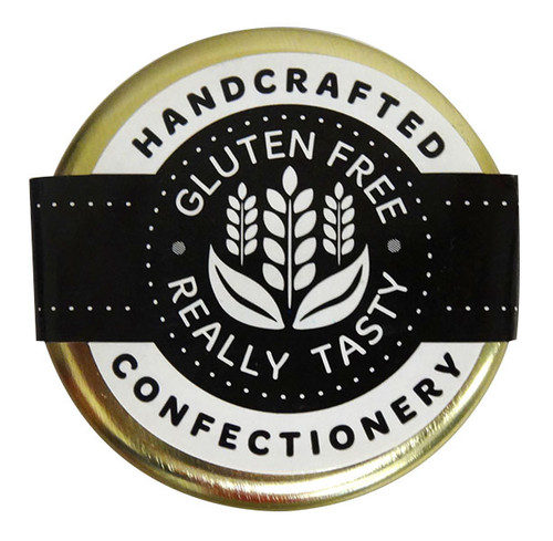 Handcrafted Happy Birthday Luxe Rock Candy in a glass jar, displaying bright rainbow hues and fun patterns.