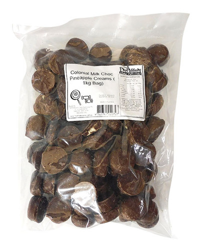 Pineapple-flavoured chocolate cream pieces in bulk 1kg packaging, perfect for themed events, available at The Professors. Pineapple-flavoured chocolate cream pieces in bulk 1kg packaging, perfect for themed events, available at The Professors.