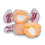 Close-up of Tangerine flavoured Taffy Town salt water taffy pieces with orange and white colours, available at The Professors.