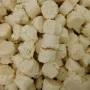 Close-up of Choco Nuts White Chocolate Coconut Rough pieces in a 5kg box, creamy white chocolate coconut confectionery from The Professors Online Lolly Shop.
