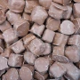 Close-up of The Confectionery House honeycomb pieces coated in milk choc, supplied in a bulk 8kg box.
