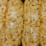 Close-up of Betta Candy Bananas 4kg box with yellow banana-shaped lollies, available at The Professors Online Lolly Shop.