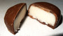 Dark chocolate peppermint cream showing solid outer shell and mint fondant centre, available at The Professors.