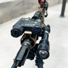 Top down view of the black DesignateIR-V three beam tactical laser integrated onto a rifle rail system 